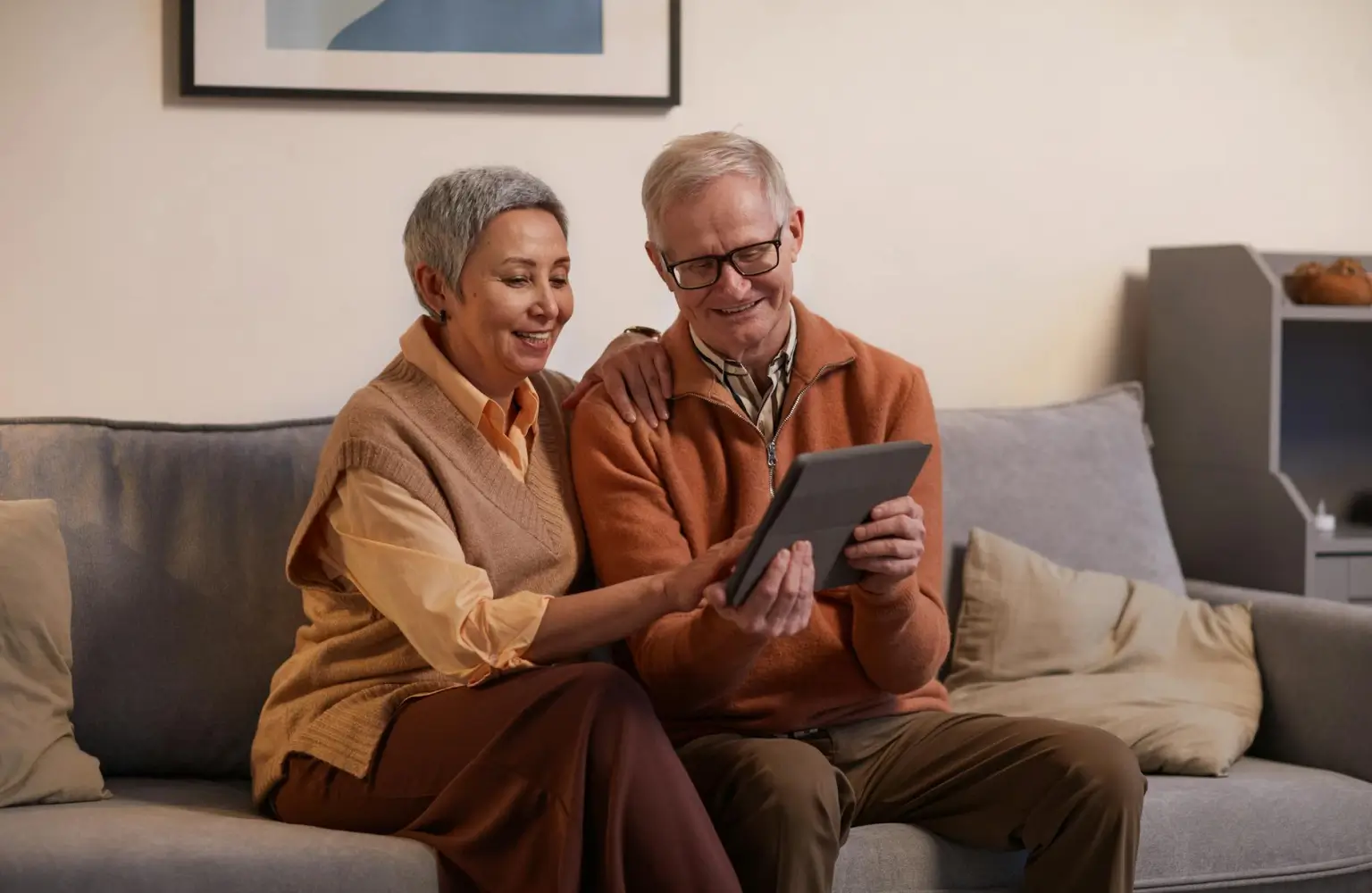 Elderly looking at tablet